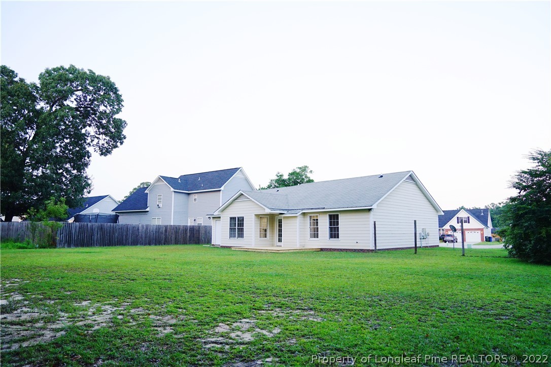 2940 Bakers Mill Road Fayetteville, NC 28306 - Photo 43 of 46 a view of a house with backyard and garden