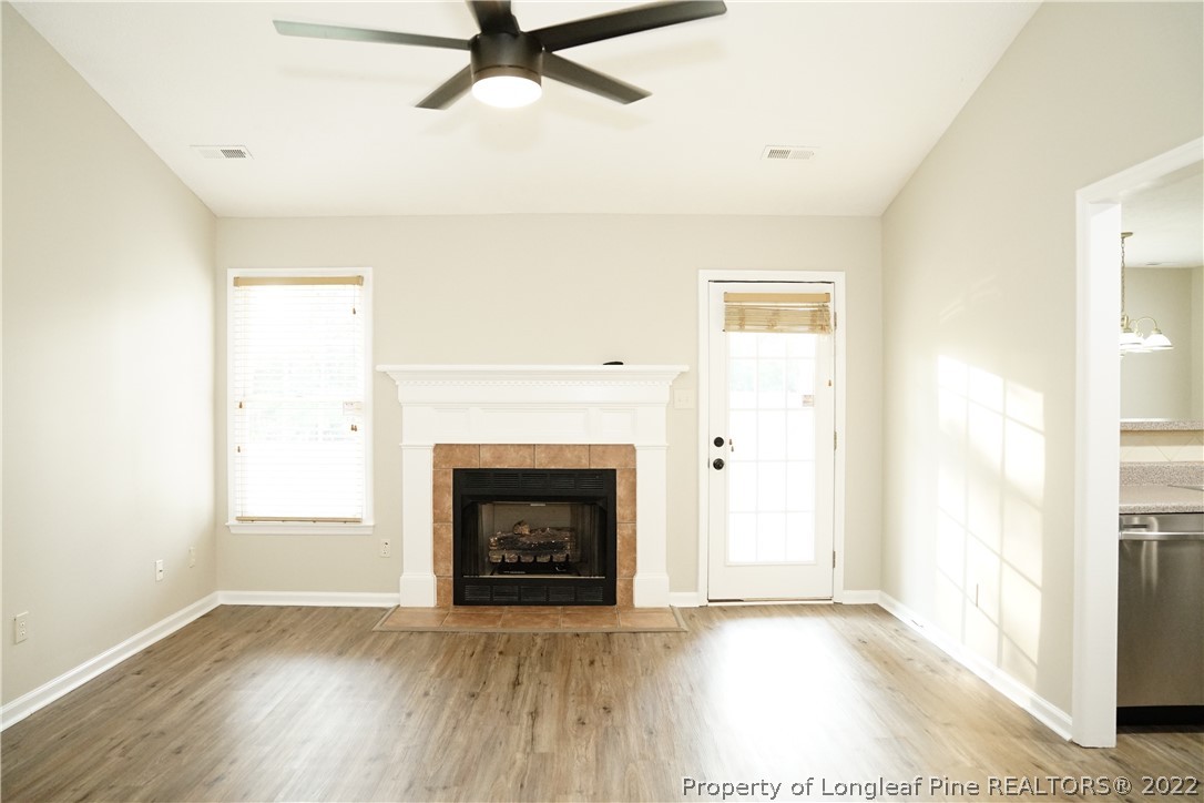 2940 Bakers Mill Road Fayetteville, NC 28306 - Photo 8 of 46 a view of an empty room with wooden floor and a window