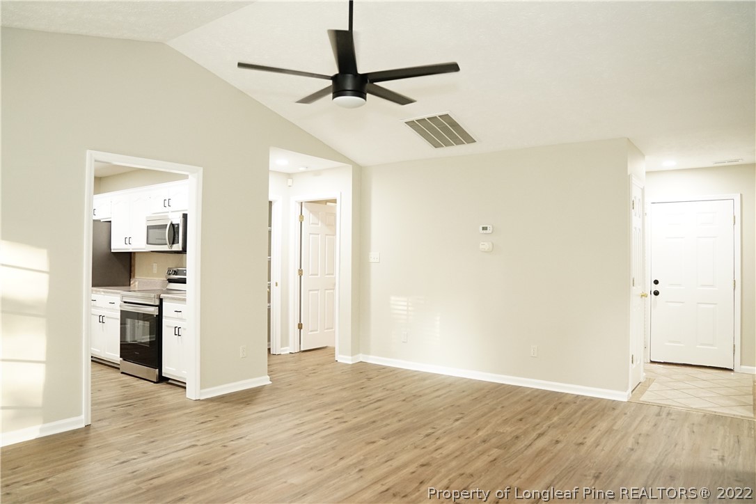 2940 Bakers Mill Road Fayetteville, NC 28306 - Photo 9 of 46 a view of a kitchen with a sink and a refrigerator