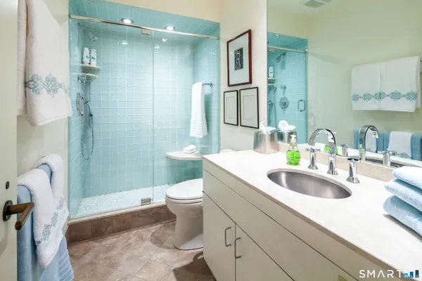 a view of a house with a yard and balcony