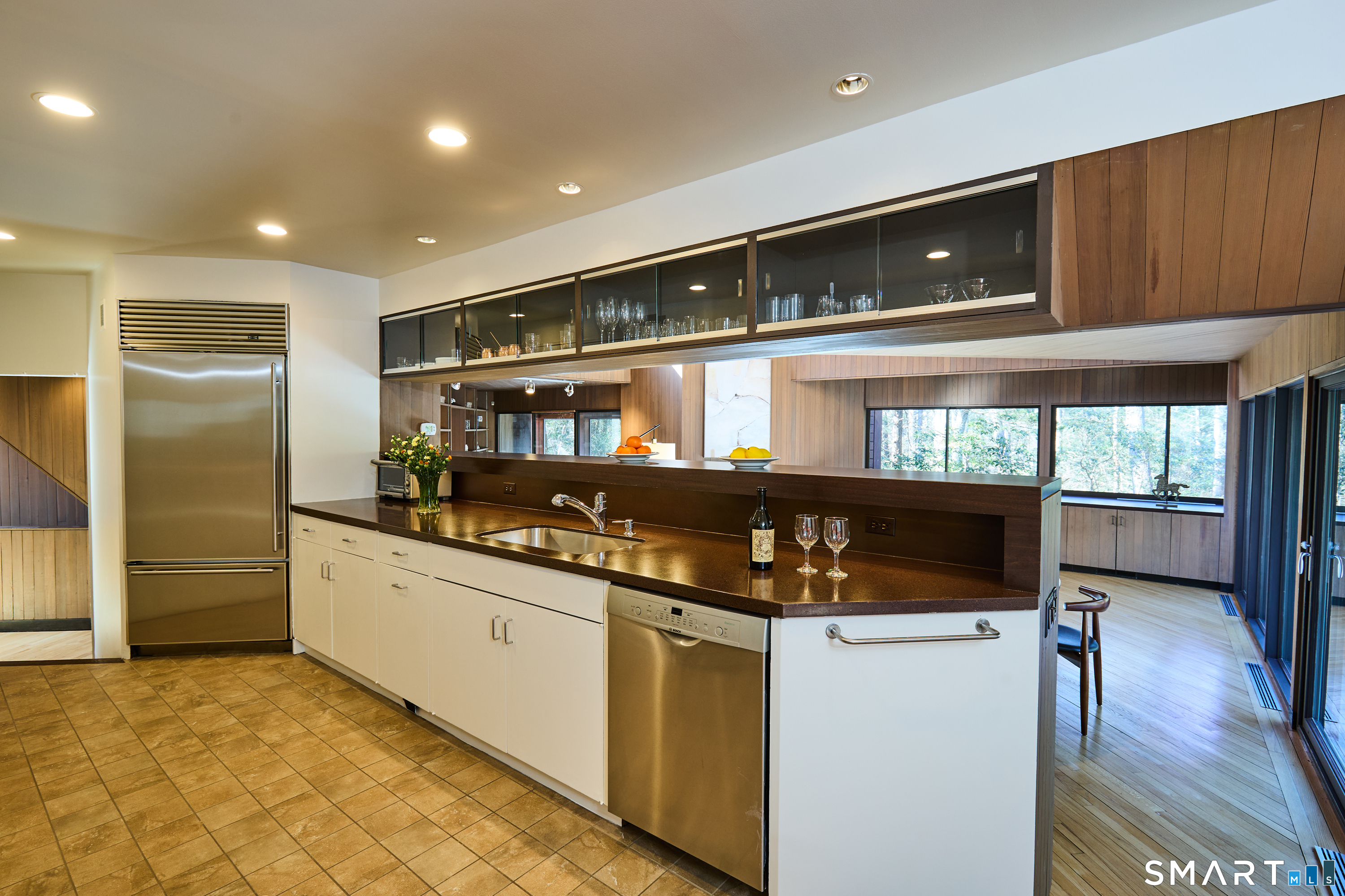 14 Codfish Lane Weston, CT 06883 - Photo 7 of 23 a kitchen with stainless steel appliances granite countertop a refrigerator and a stove top oven