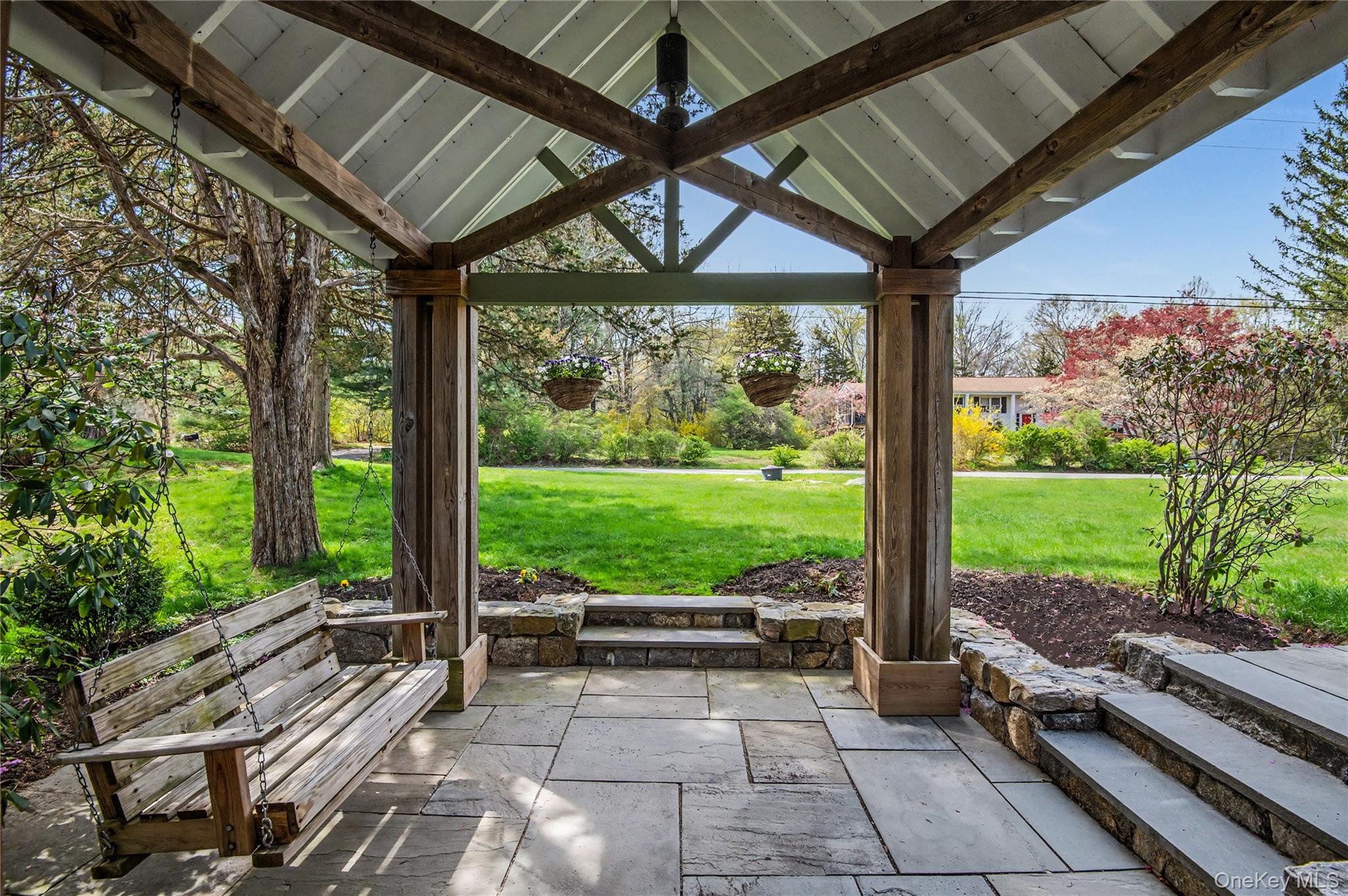 41 Cross Pond Road Pound Ridge, NY 10576 - Photo 37 of 41 a view of a patio with a table chairs and a backyard