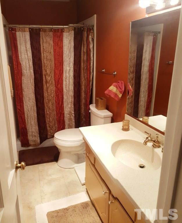 6600 King Lawrence Road Raleigh, NC 27607 - Photo 14 of 25 a bathroom with a sink toilet and shower