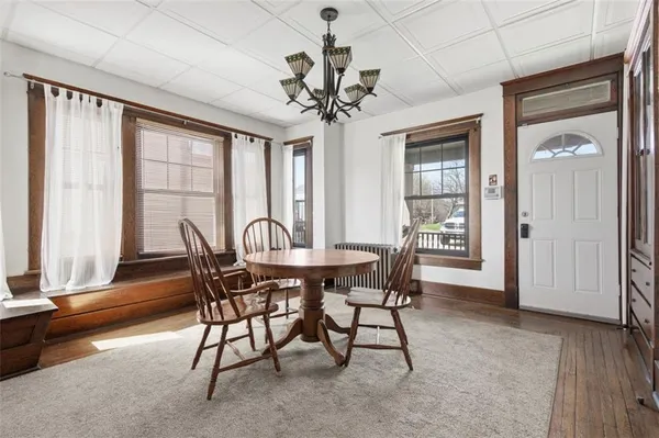 a view of a room with furniture window and wooden floor