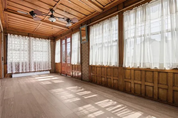 a view of a brick house with a large window