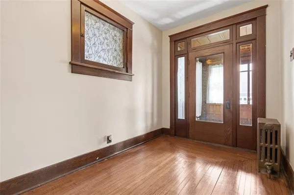 a living room with furniture a window and a fireplace