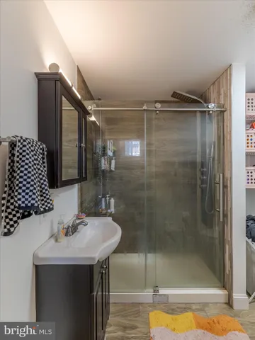 a bathroom with a sink and mirror
