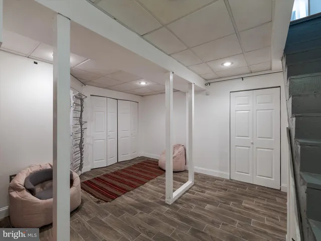 a view of an empty room and wooden floor