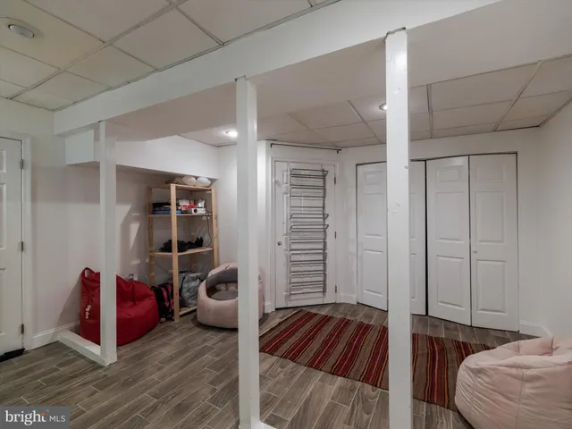 a bedroom with furniture and a book shelf