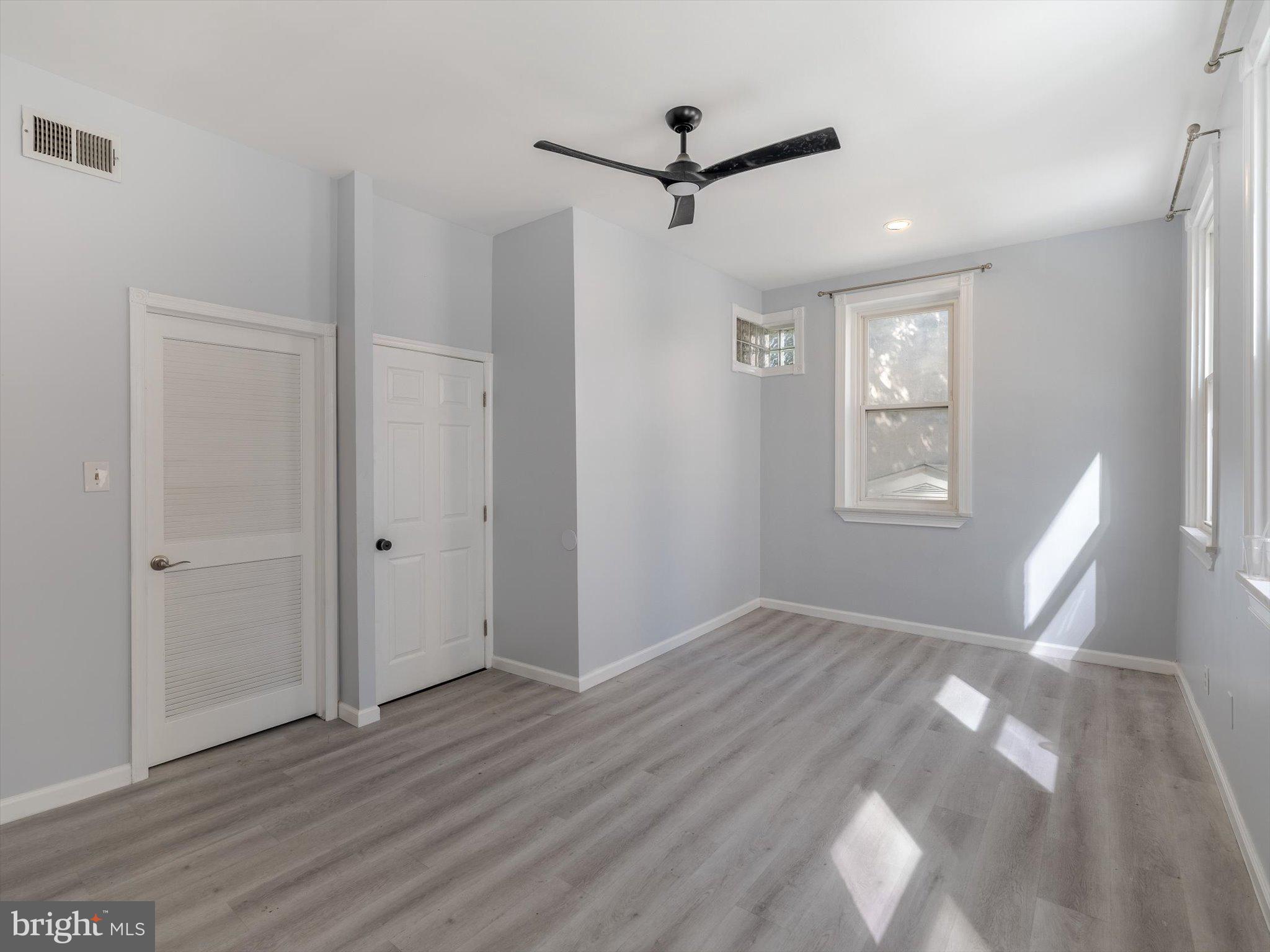 1108 Locust Street Philadelphia, PA 19107 - Photo 23 of 33 a view of empty room with wooden floor and fan