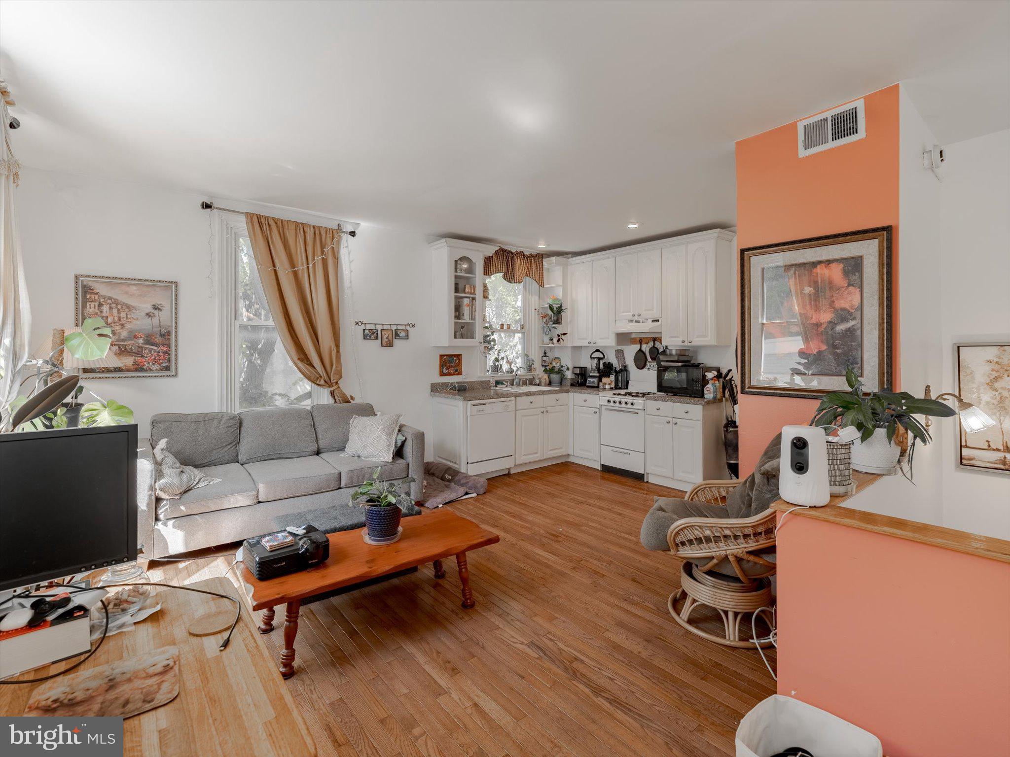 1108 Locust Street Philadelphia, PA 19107 - Photo 28 of 33 a living room with furniture and a flat screen tv