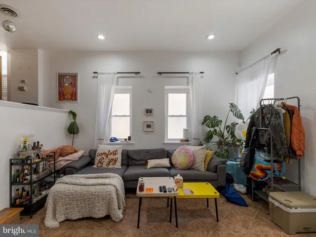 a bedroom with bed and a window
