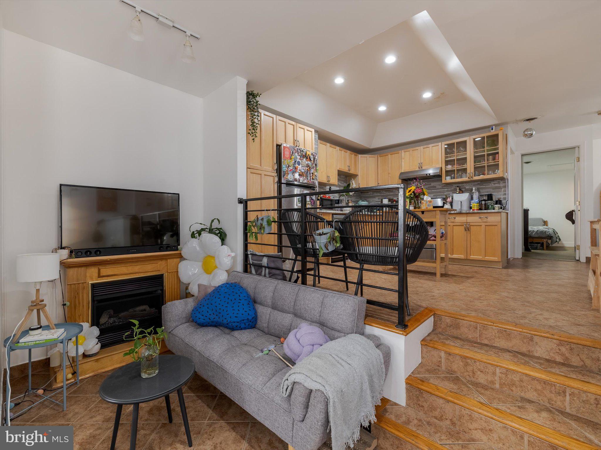 1108 Locust Street Philadelphia, PA 19107 - Photo 6 of 33 a living room with furniture and a flat screen tv