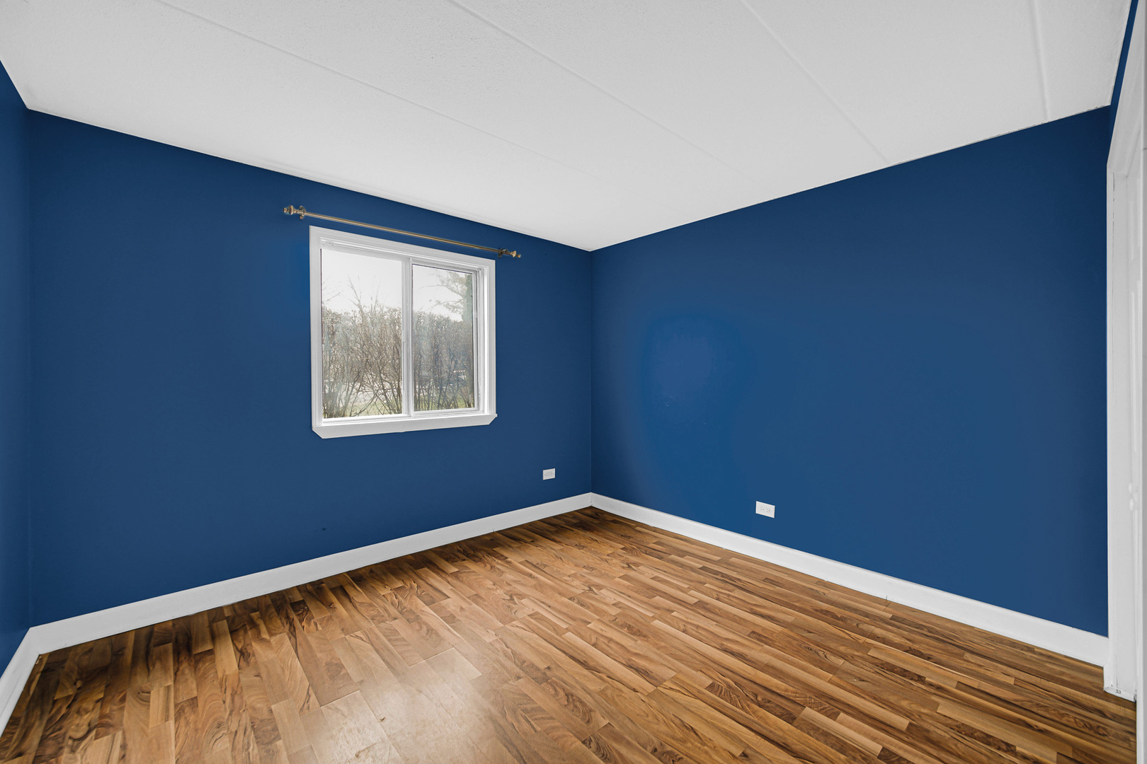 491 Timber Ridge Drive, Unit 101 Carol Stream, IL 60188 - Photo 14 of 19 a view of empty room with wooden floor