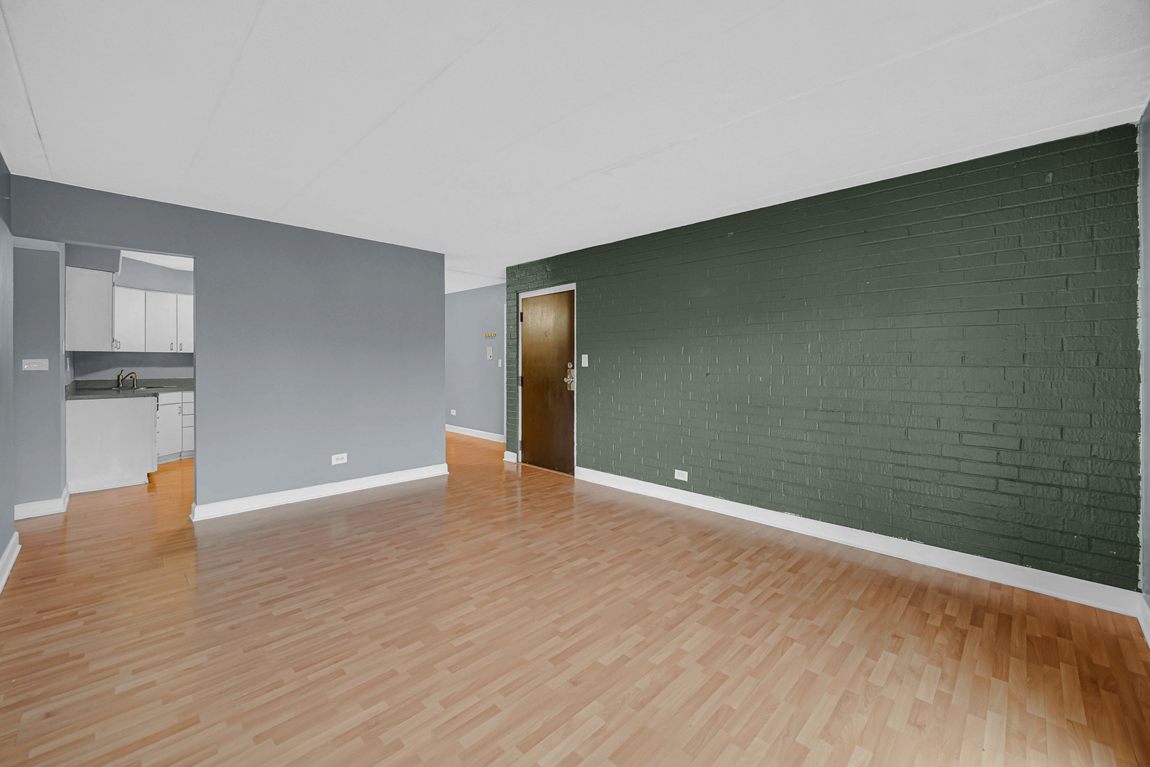 491 Timber Ridge Drive, Unit 101 Carol Stream, IL 60188 - Photo 9 of 19 a view of an empty room with wooden floor