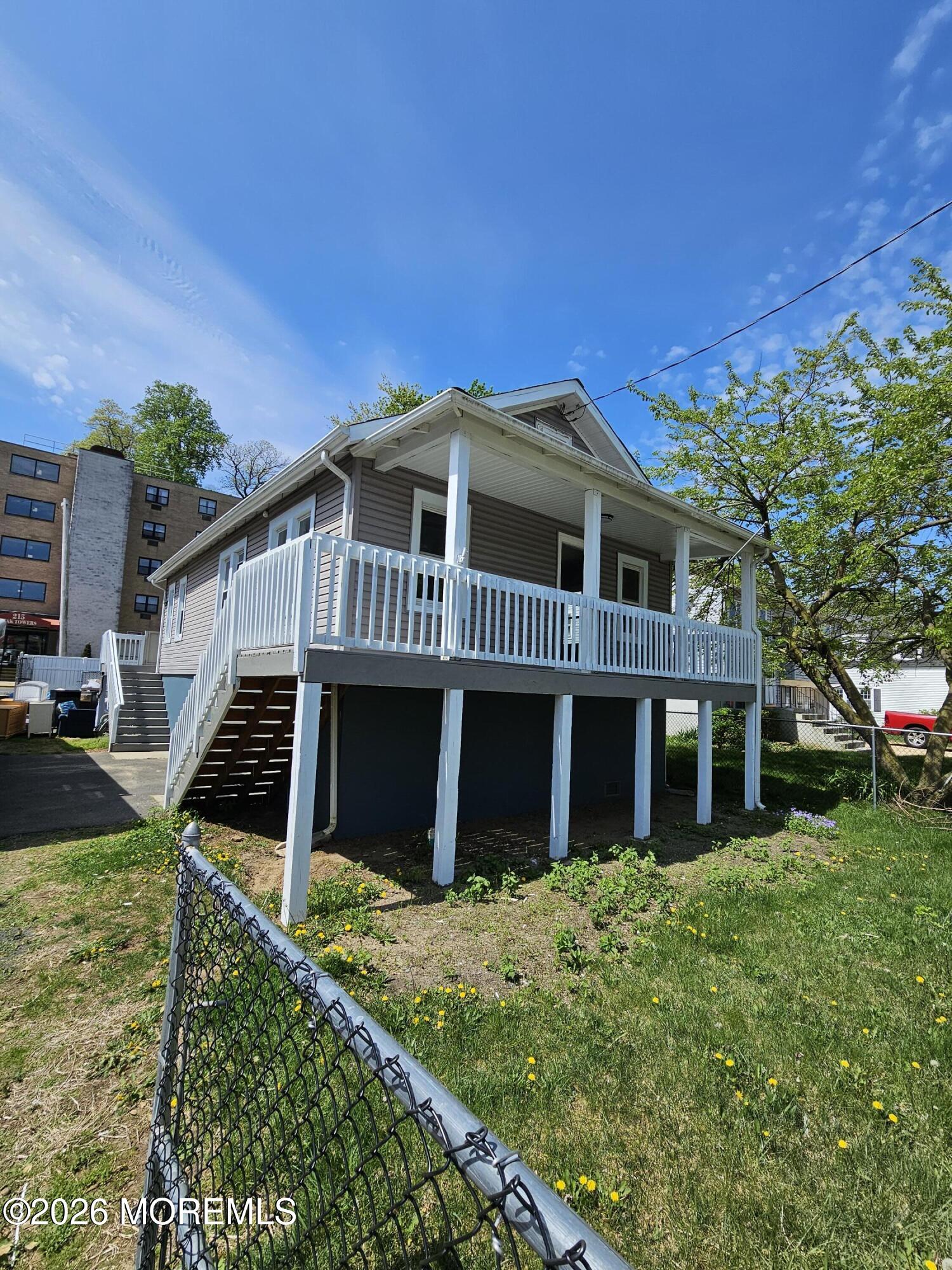 57 2nd Street Highlands, NJ 07732 - Photo 2 of 10 a front view of a house with a yard