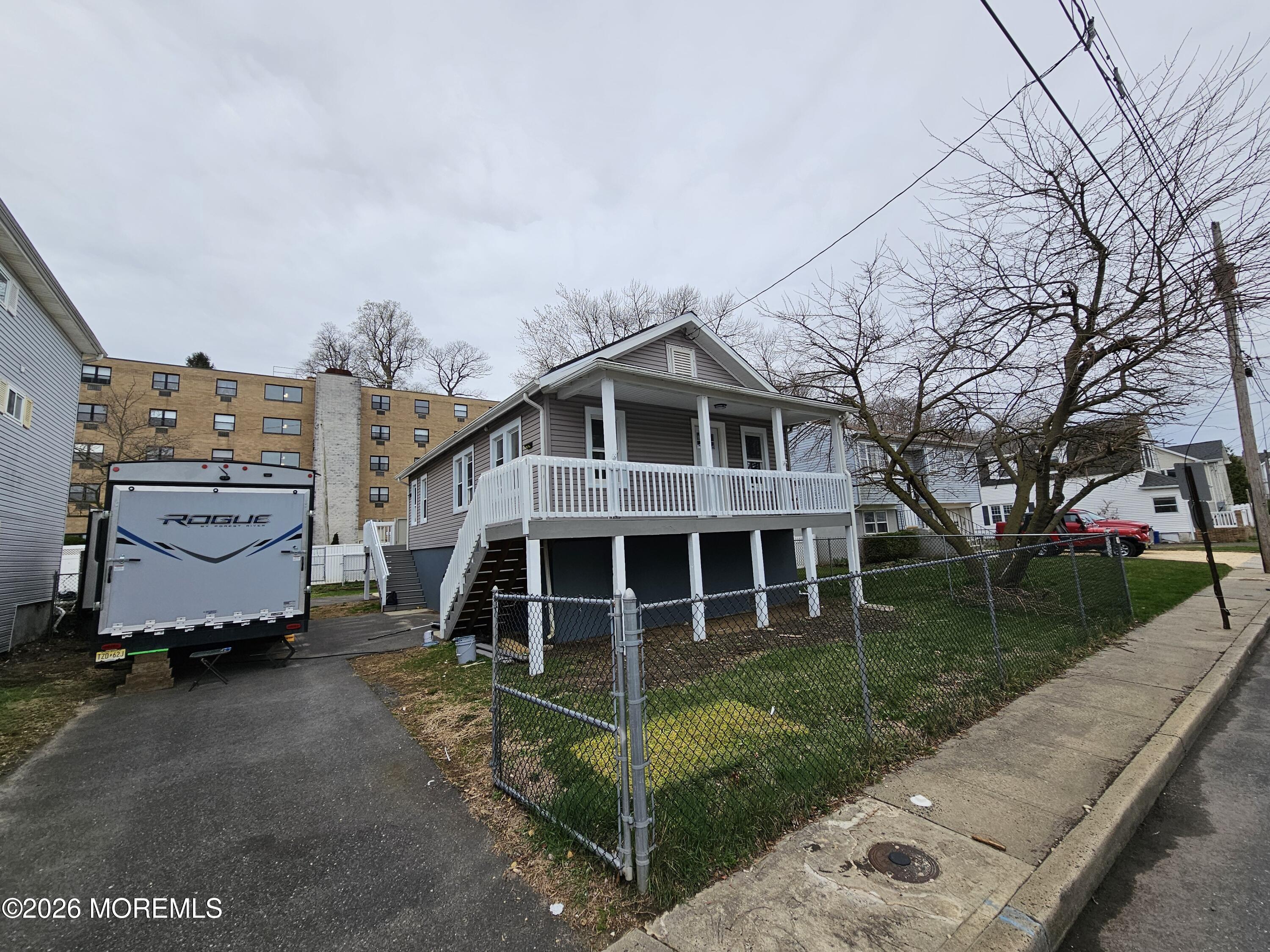 57 2nd Street Highlands, NJ 07732 - Photo 3 of 10 a view of a house with a yard