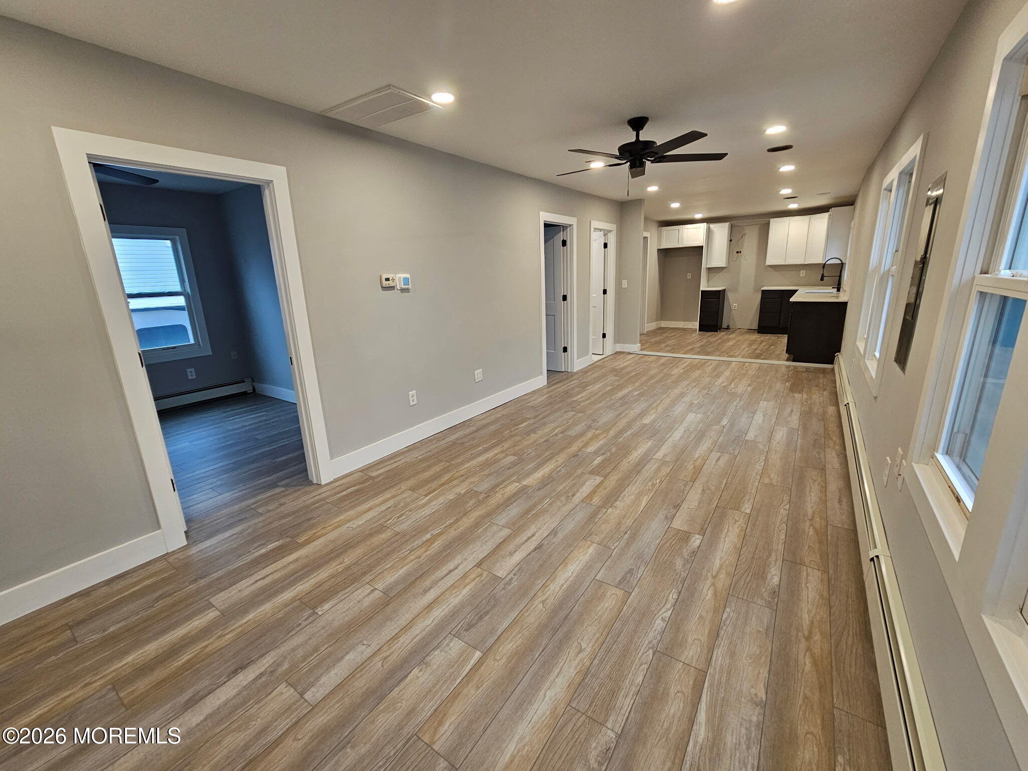 57 2nd Street Highlands, NJ 07732 - Photo 5 of 10 a view of livingroom with hardwood floor and a ceiling fan