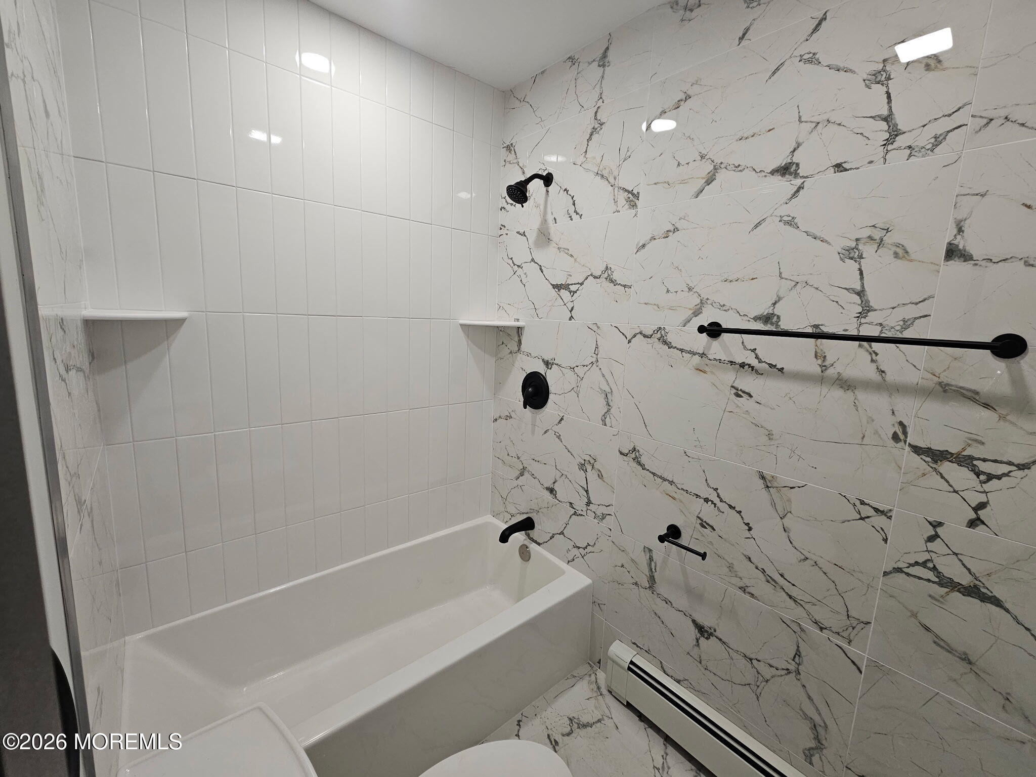 57 2nd Street Highlands, NJ 07732 - Photo 8 of 10 a bathroom with a bathtub and shower