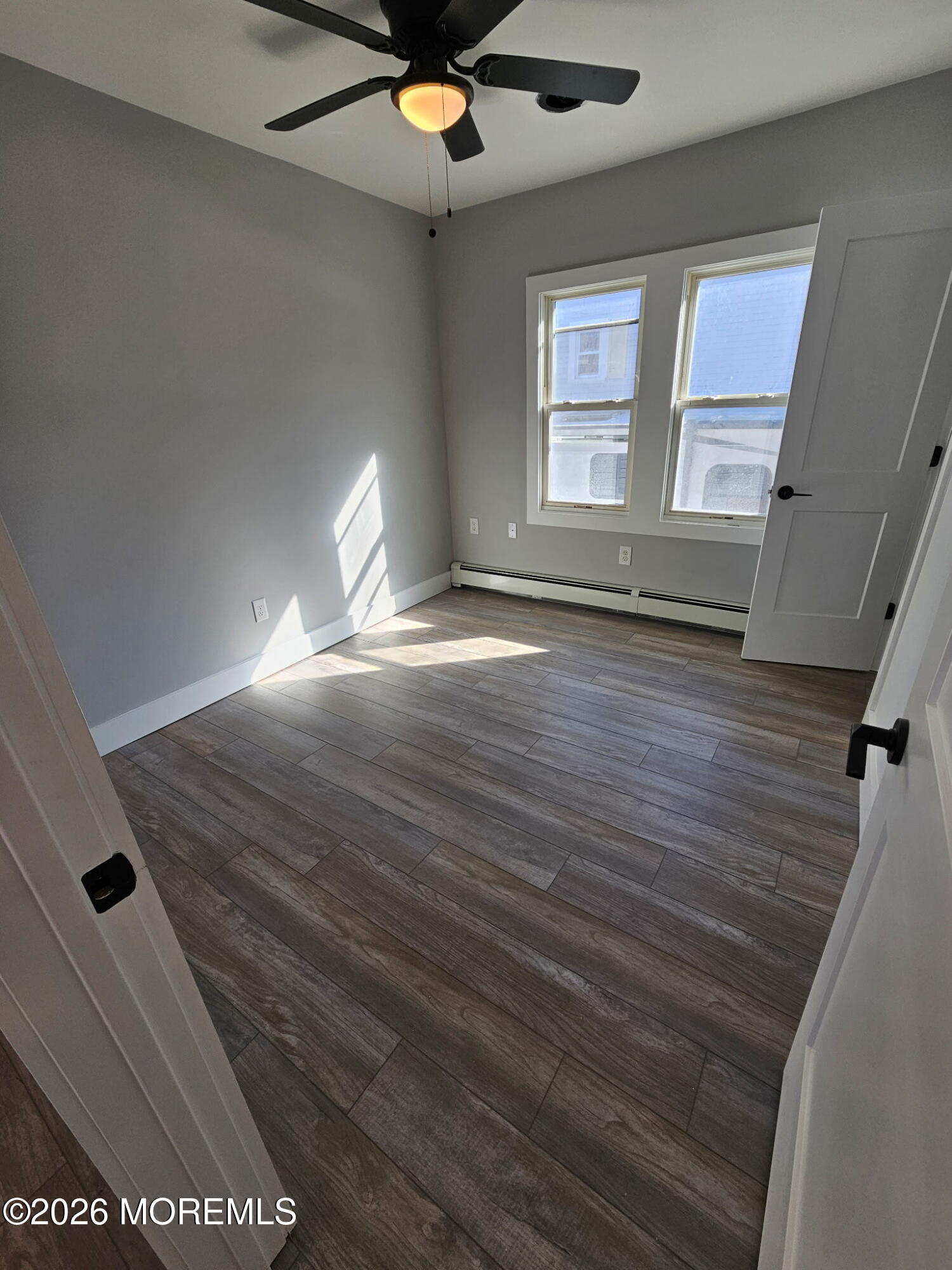 57 2nd Street Highlands, NJ 07732 - Photo 9 of 10 wooden floor in an empty room with a window
