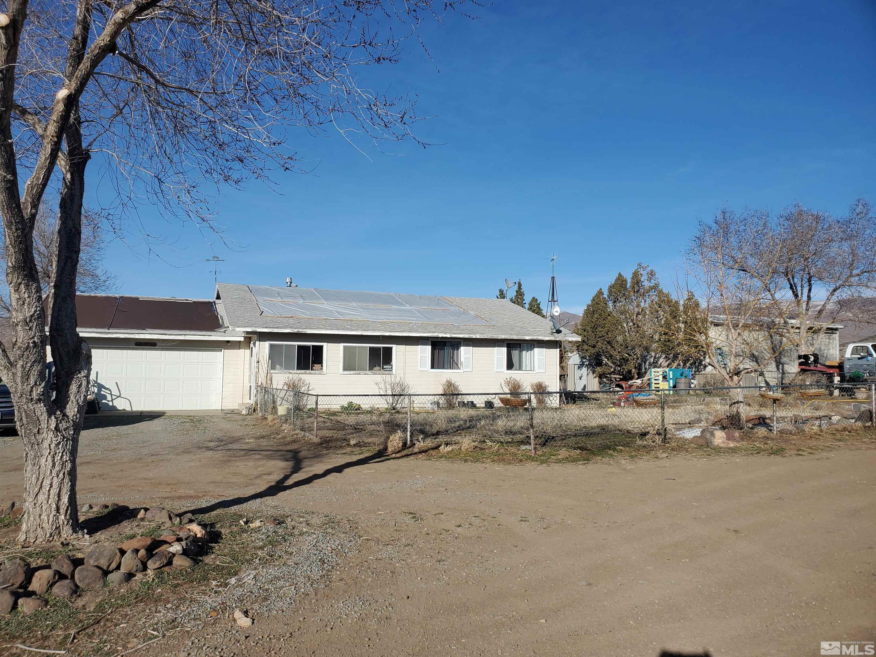 5100 Wilcox Ranch Road Reno, NV 89510 - Photo 1 of 8 a view of a house with a snow on the road