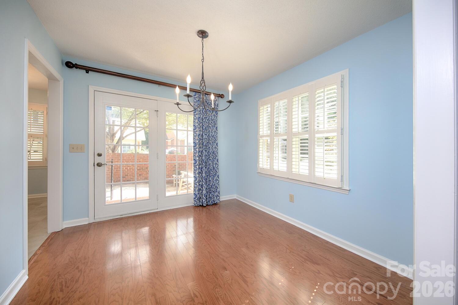 783 Union Street South Concord, NC 28025 - Photo 13 of 46 a view of an empty room with wooden floor and a window