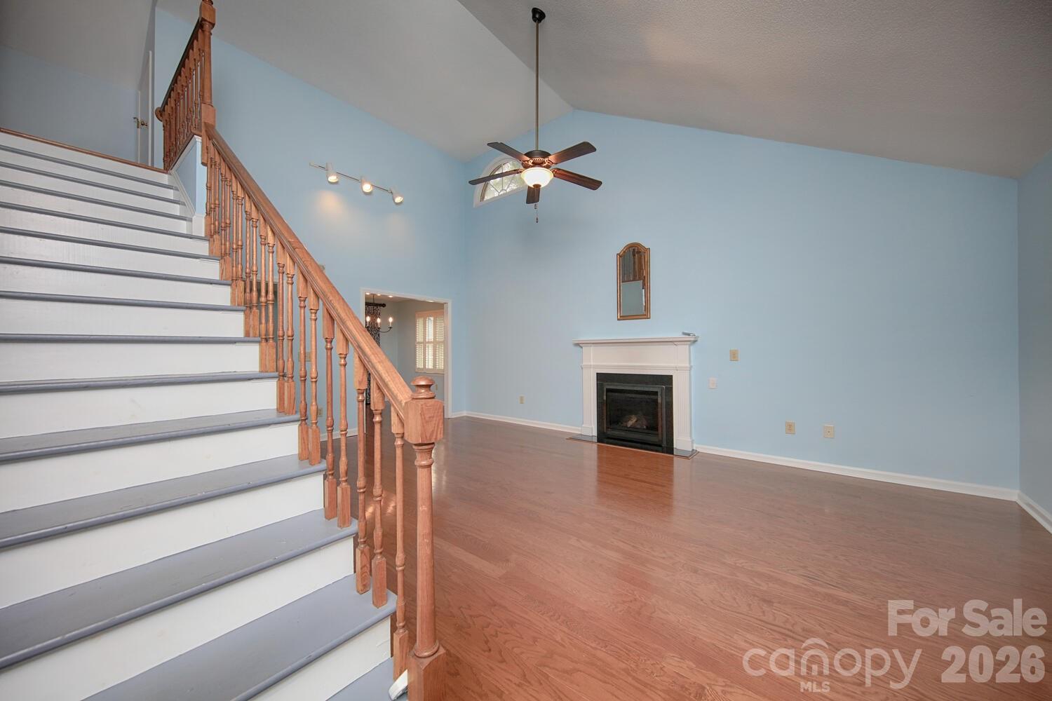 783 Union Street South Concord, NC 28025 - Photo 15 of 46 a view of a livingroom with wooden floor and a ceiling fan