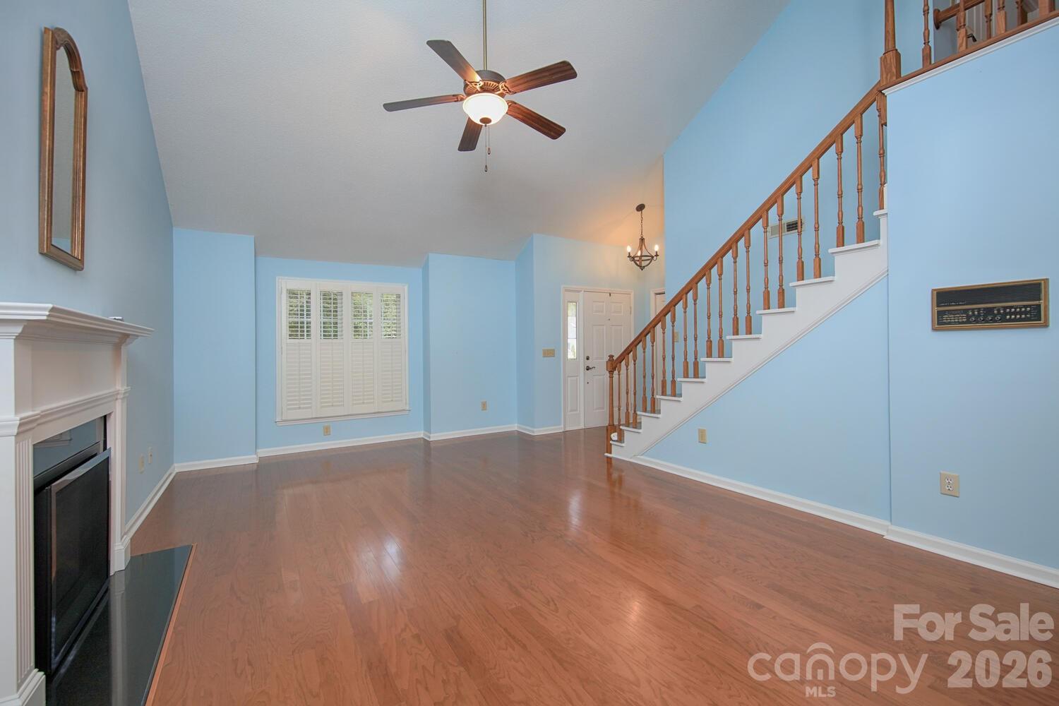 783 Union Street South Concord, NC 28025 - Photo 18 of 46 a view of empty room with fireplace and fan