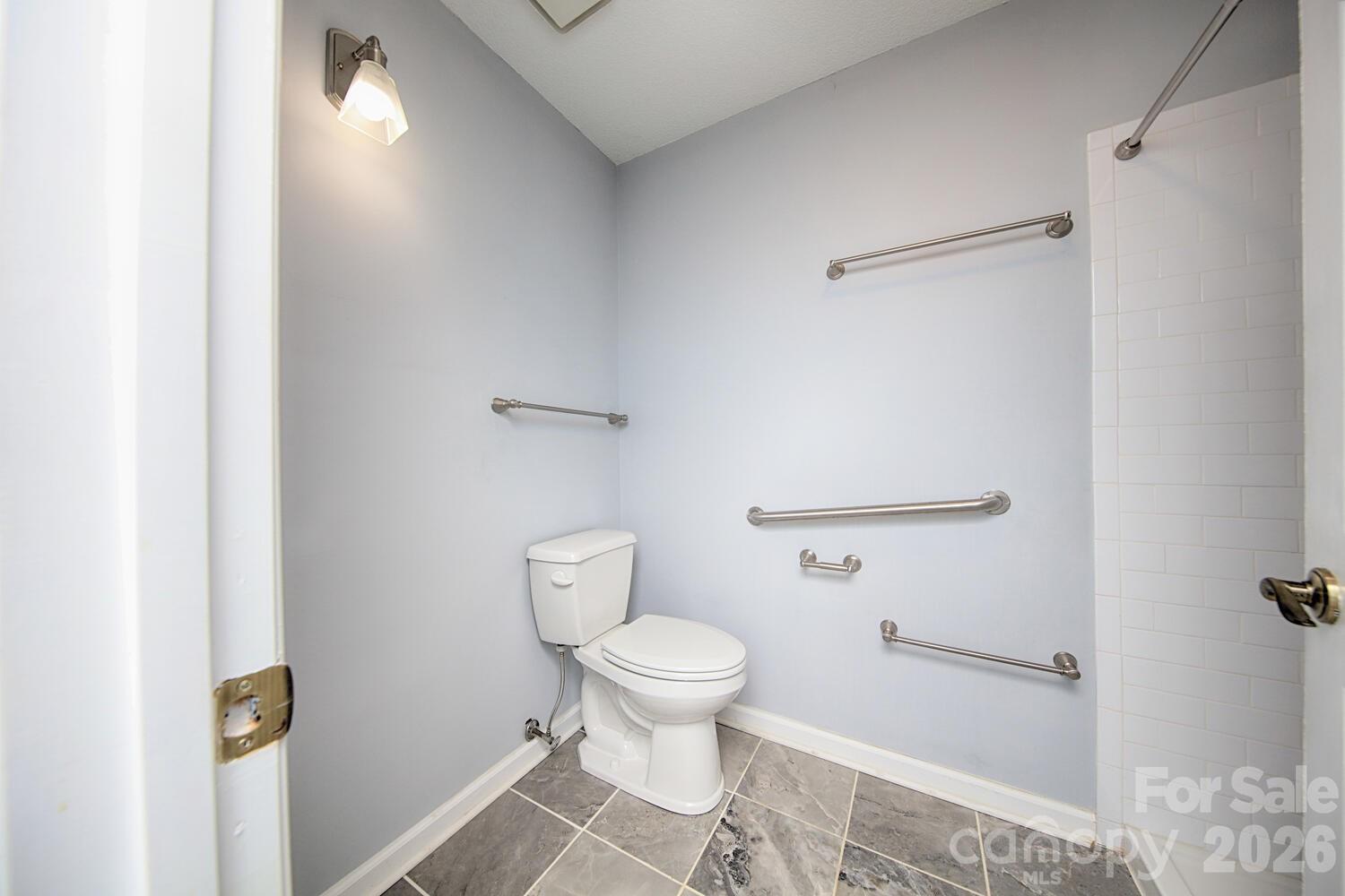 783 Union Street South Concord, NC 28025 - Photo 27 of 46 a bathroom with a toilet and a shower