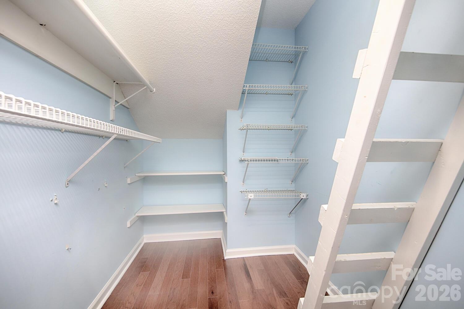 783 Union Street South Concord, NC 28025 - Photo 34 of 46 a view of walk in closet with empty racks
