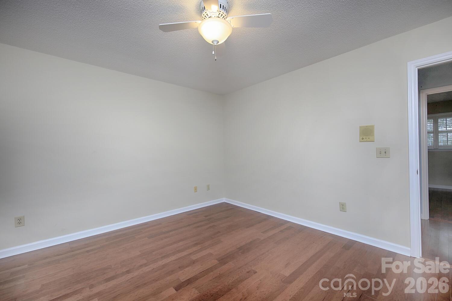 783 Union Street South Concord, NC 28025 - Photo 36 of 46 a view of a room with wooden floor and a chandelier