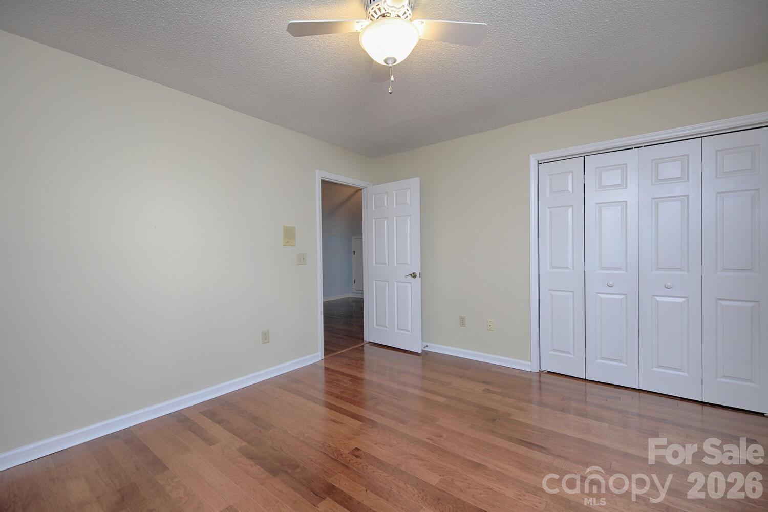 783 Union Street South Concord, NC 28025 - Photo 37 of 46 a view of an empty room with wooden floor