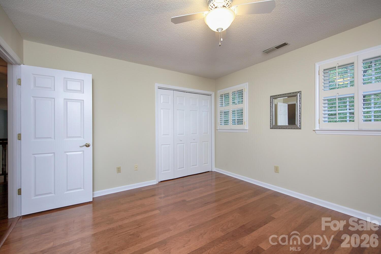 783 Union Street South Concord, NC 28025 - Photo 38 of 46 a view of an empty room with wooden floor and a window