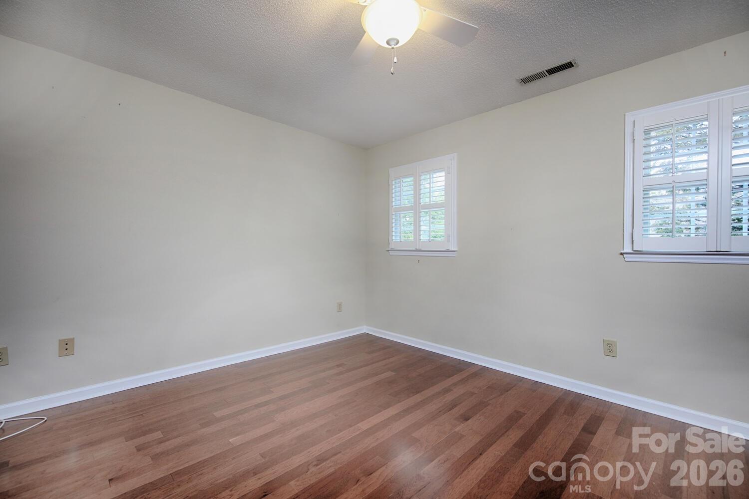 783 Union Street South Concord, NC 28025 - Photo 39 of 46 a view of a room that has wooden floor and windows in it
