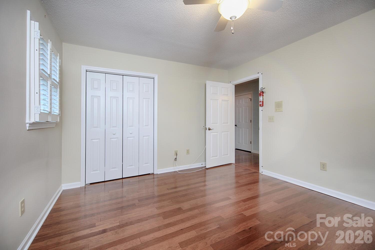 783 Union Street South Concord, NC 28025 - Photo 41 of 46 an empty room with wooden floor and windows
