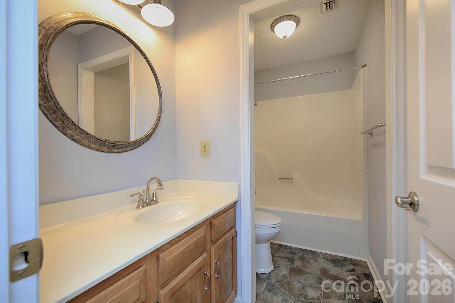 783 Union Street South Concord, NC 28025 - Photo 42 of 46 a bathroom with a sink a toilet and shower