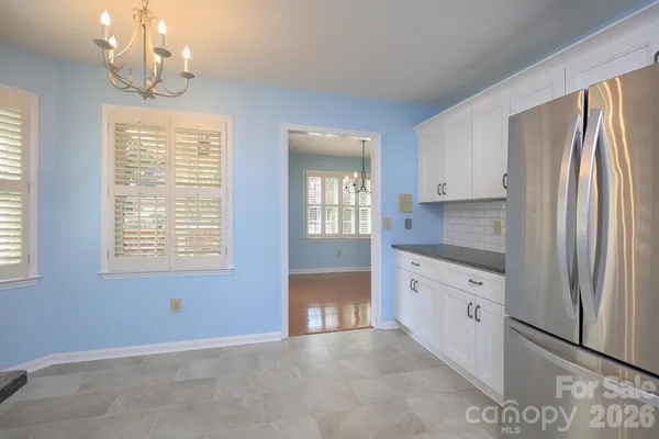 a large kitchen with window