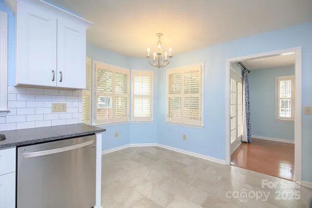 a kitchen that has a lot of cabinets in it