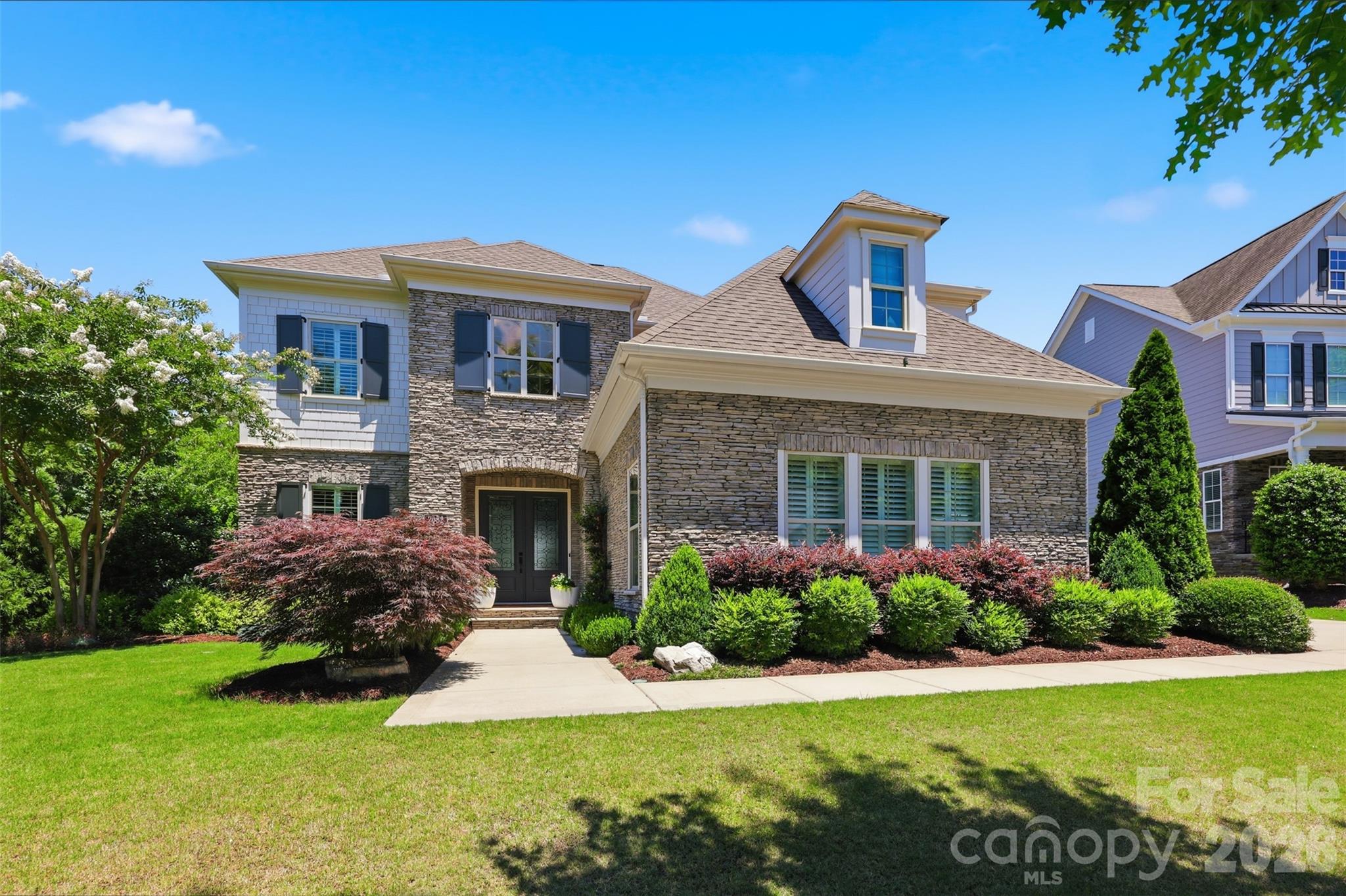 2082 Tatton Hall Road Fort Mill, SC 29715 - Photo 2 of 48 a front view of a house with a yard and garage