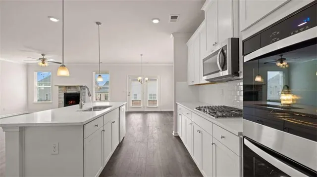 a view of a room with wooden floor and cabinet