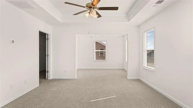 a bathroom with a bathtub shower and a sink