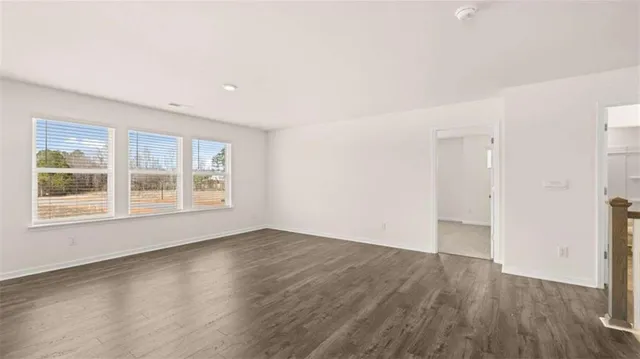 an empty room with closet area