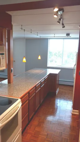 a kitchen with stainless steel appliances granite countertop a sink and a granite counter tops