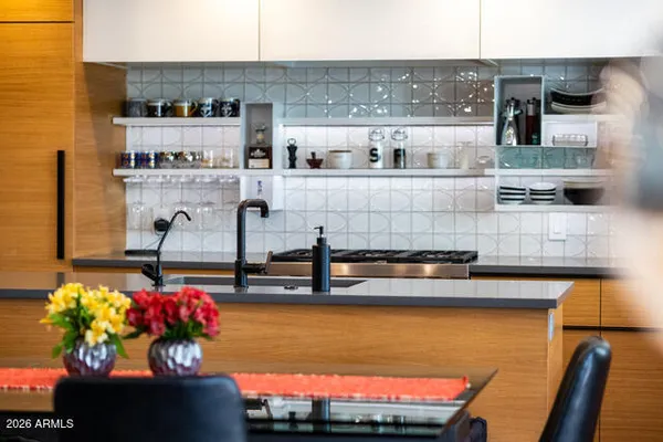 a picture of a living room with furniture and flowers