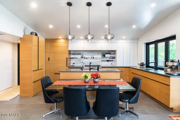 a view of a dining table and chairs