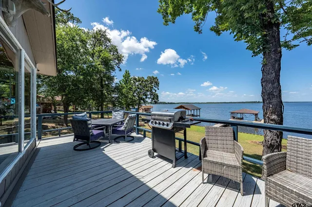 a view of a balcony with chairs