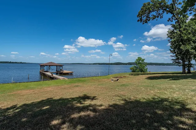 a view of a swimming pool with an outdoor space and seating area