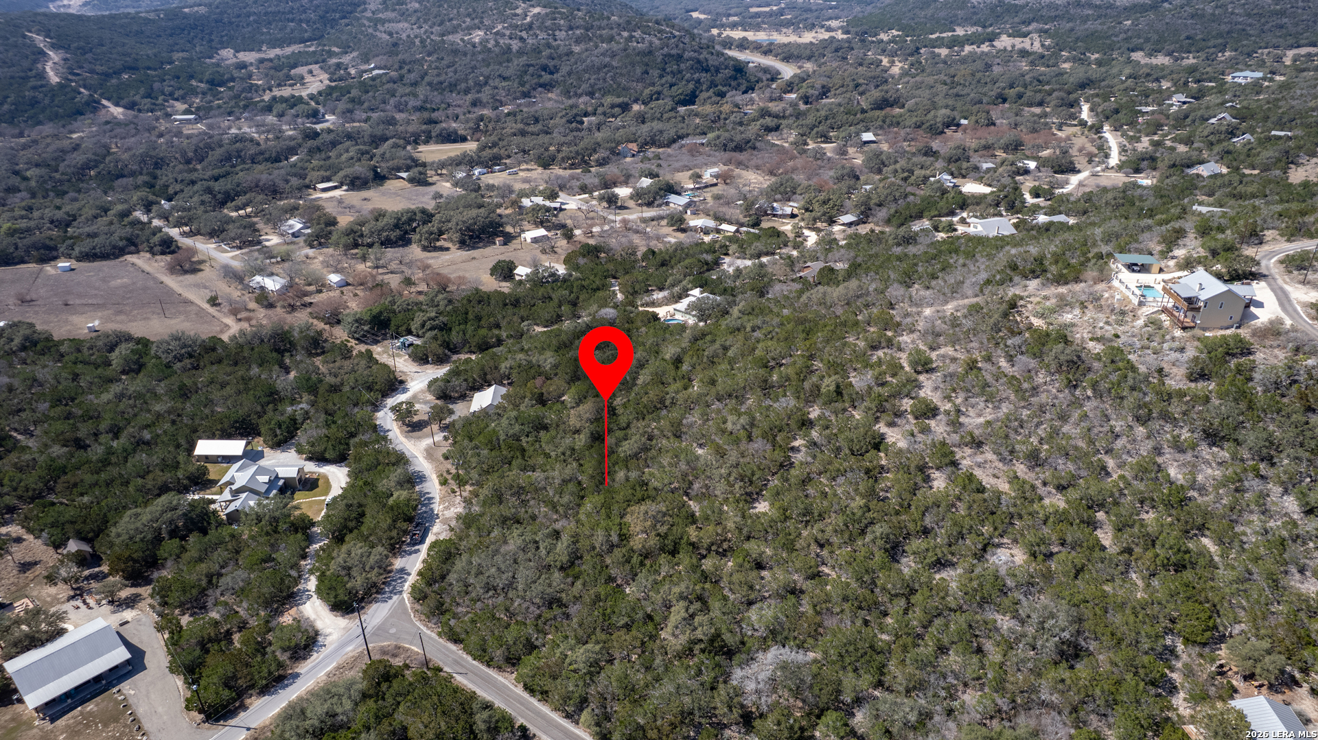 439 Mariposa Concan, TX 78838 - Photo 2 of 8 a view of a house with a tree