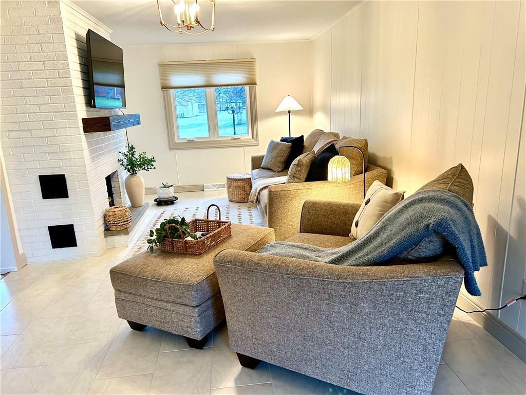 113 Memorial Street Dunbar, PA 15431 - Photo 14 of 42 a living room with furniture and a flat screen tv