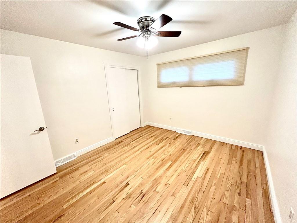 113 Memorial Street Dunbar, PA 15431 - Photo 25 of 42 a view of a room with wooden floor and a ceiling fan